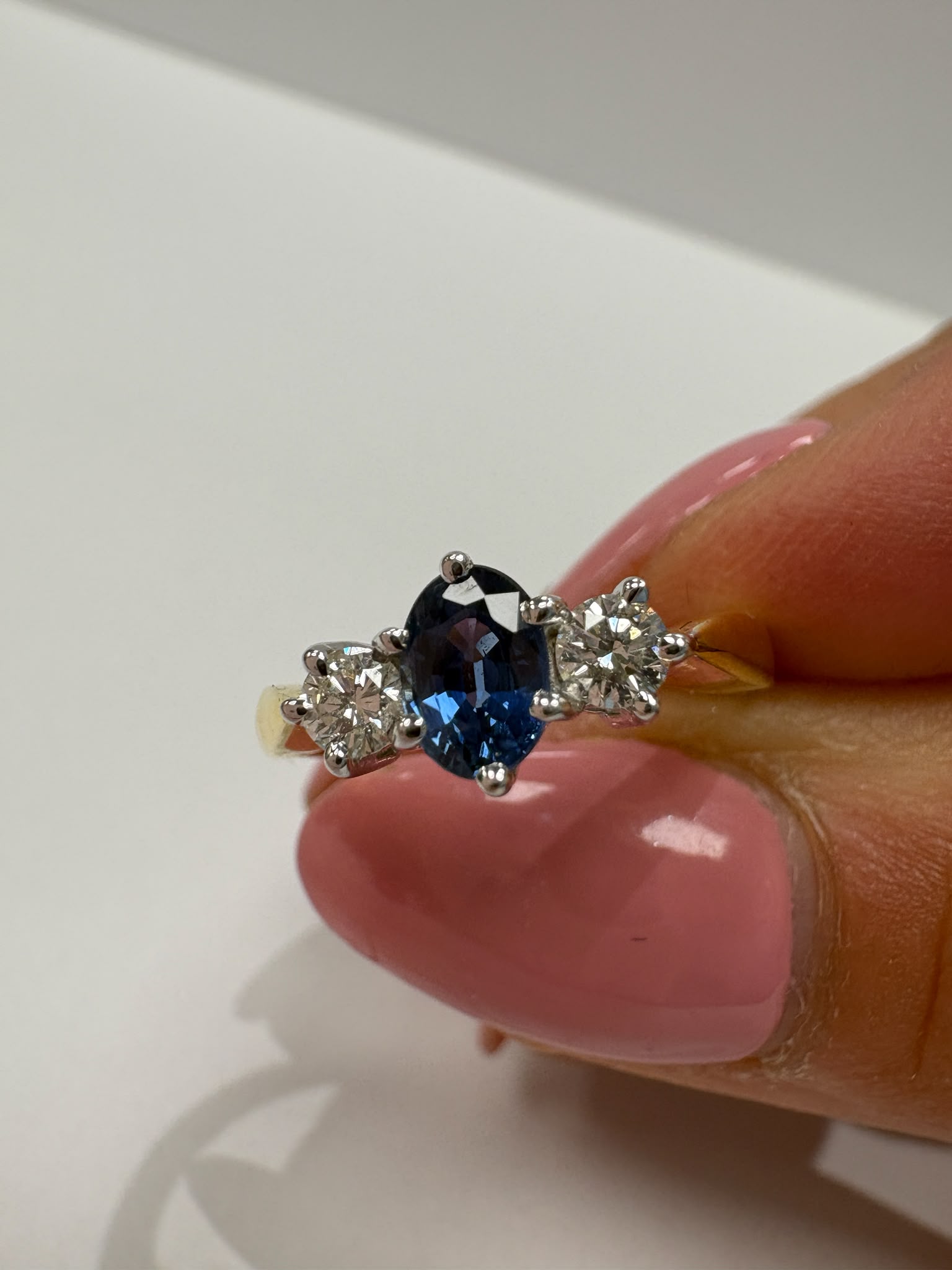sapphire and diamond ring, three stone sapphire ring, 18ct gold sapphire ring, second hand sapphire ring UK, pre-loved sapphire ring, vintage sapphire ring, oval sapphire ring, September birthstone ring, sapphire trilogy ring, second hand jewellery Harrogate, second hand jewellery Leeds, second hand jewellery York, second hand jewellery Yorkshire, pre-owned sapphire ring UK, 18ct sapphire engagement ring, buy second hand sapphire ring, sapphire ring size L, sapphire ring near me, fine jewellery Harrogate, p