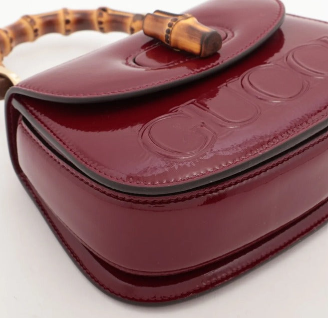 pre-loved Gucci bag UK, Gucci Bamboo 1947 Mini, Gucci Bamboo bag, Gucci Rosso Ancora, red Gucci bag, Gucci patent bag, second hand Gucci UK, Gucci top handle bag, luxury handbags Harrogate, pre-loved designer bags Yorkshire