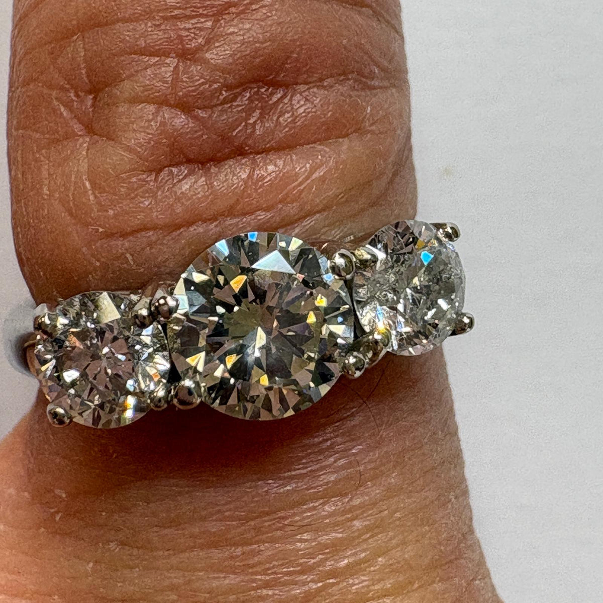 three stone diamond ring, trilogy diamond ring UK, platinum diamond ring, pre-loved engagement ring, second hand diamond ring, 1.5 carat diamond ring, anniversary diamond ring, pre-owned trilogy ring