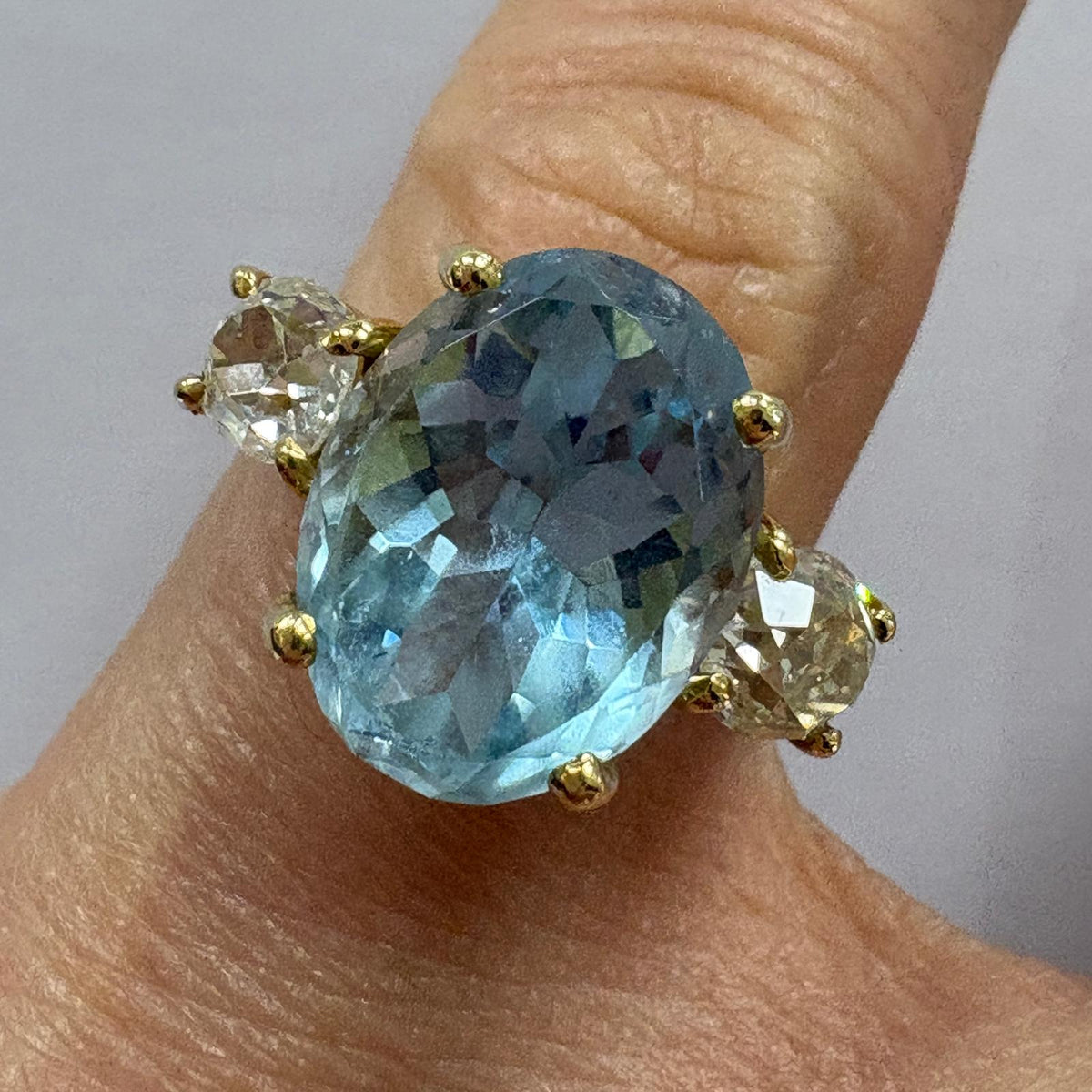 aquamarine engagement ring, old mine cut diamond ring UK, aquamarine and diamond ring, three stone aquamarine ring, alternative engagement ring, antique diamond ring, March birthstone ring, 18ct gold aquamarine ring