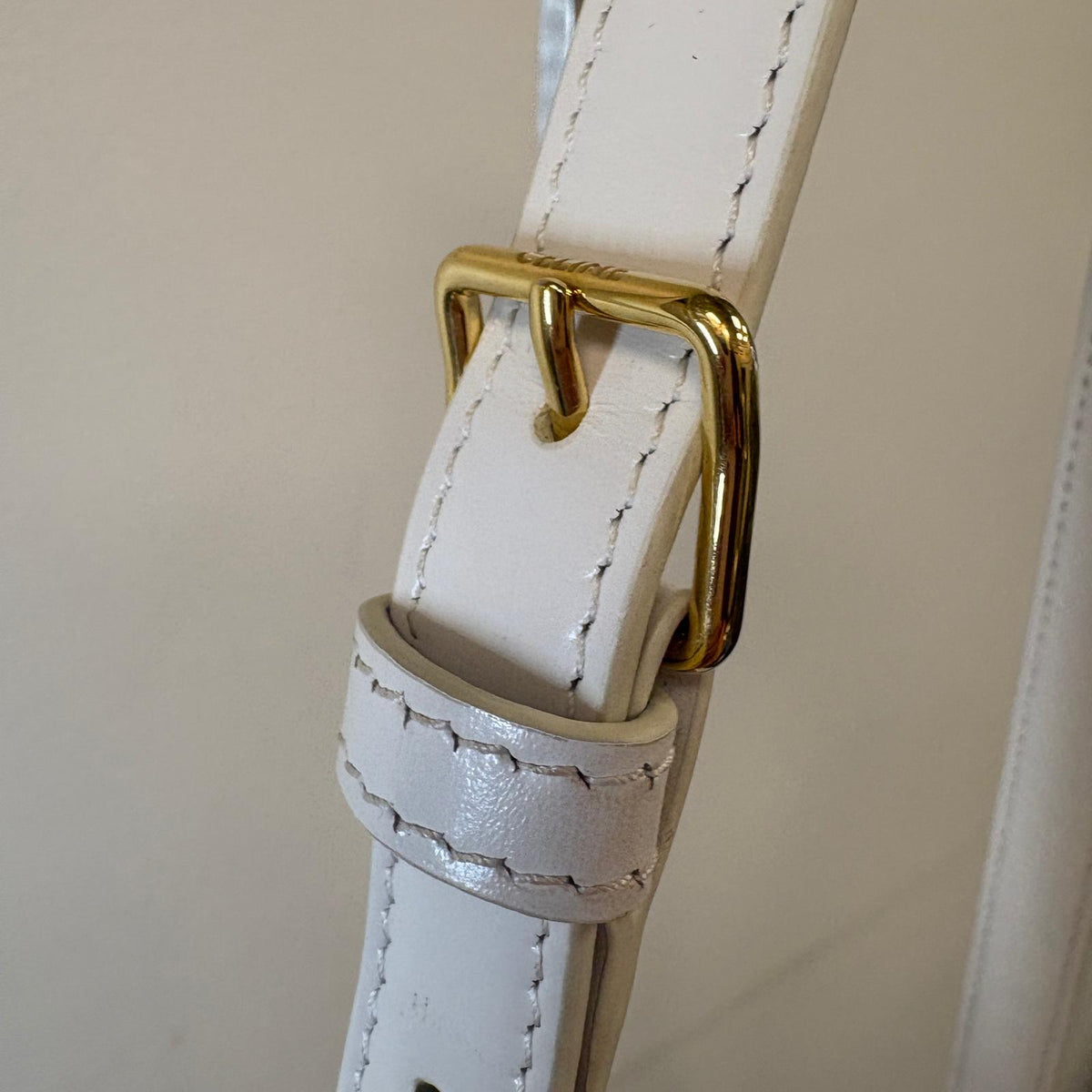 Celine Teen Triomphe, pre-loved Celine bag UK, white Celine Triomphe bag, second hand Celine handbag, Celine Triomphe shoulder bag, Celine crossbody bag, preowned designer handbag UK, Celine shiny calfskin