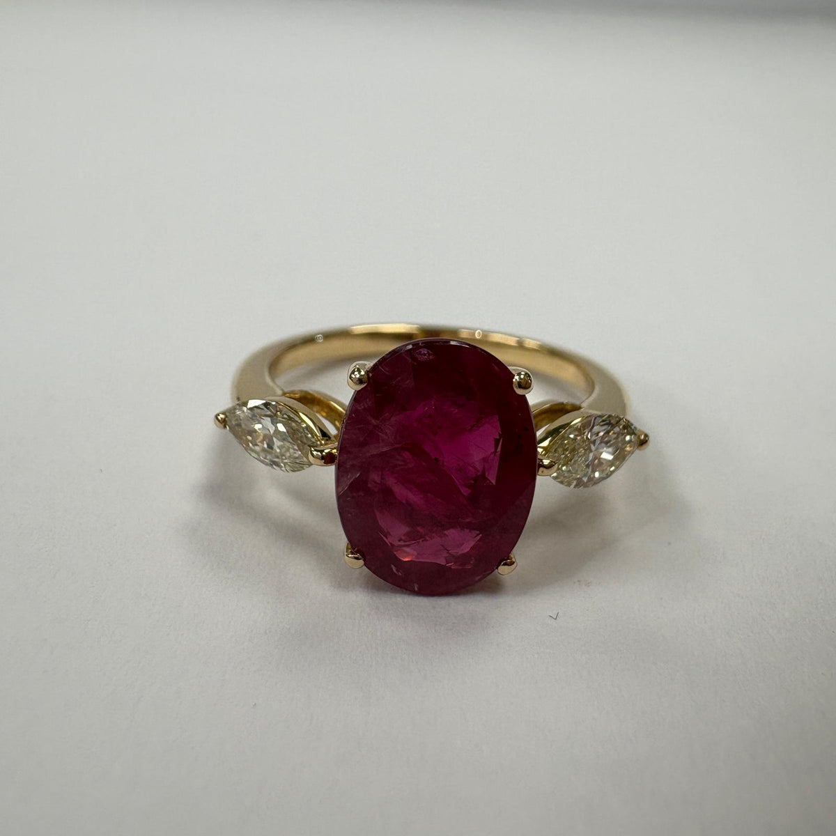 ruby and diamond ring, 3 carat ruby ring, oval ruby ring UK, marquise diamond ring, east west marquise ring, ruby engagement ring, ruby anniversary ring, 18ct gold ruby ring