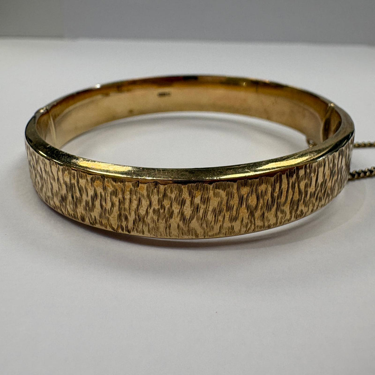 vintage gold bangle UK, bark effect bangle, 1970s gold bangle, 9ct gold hinged bangle, 1973 birth year gift, textured gold bangle, vintage 9ct gold bracelet, gold bangle with safety chain