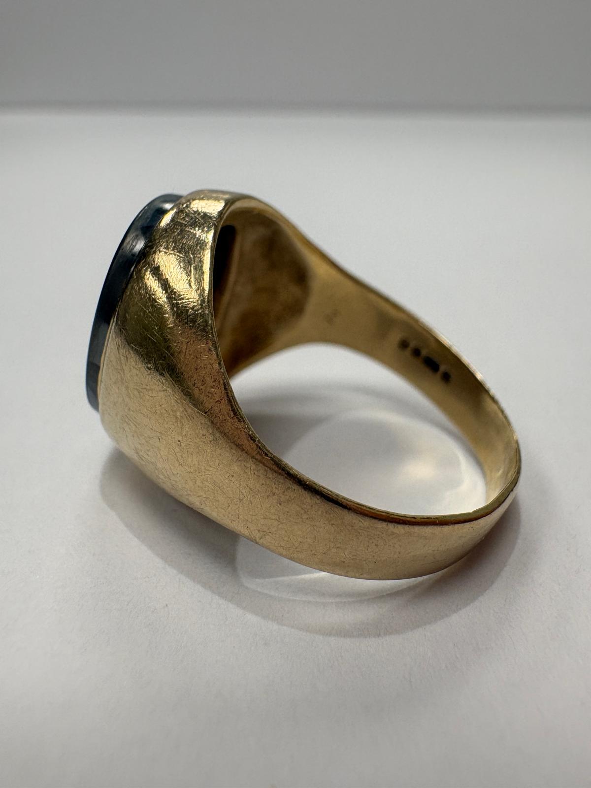 Signet ring displayed on ring cone, side angle, hematite intaglio visible