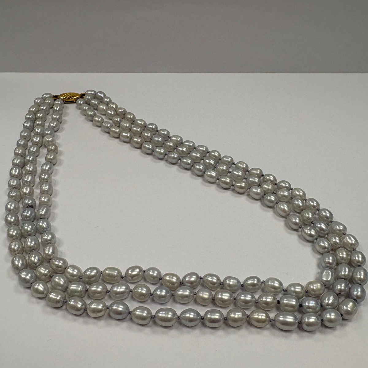 grey pearl necklace, triple strand pearl necklace, freshwater pearl necklace UK, multi strand pearl necklace, silver grey pearls, pearl necklace gold clasp, pre-loved pearl necklace, statement pearl necklace