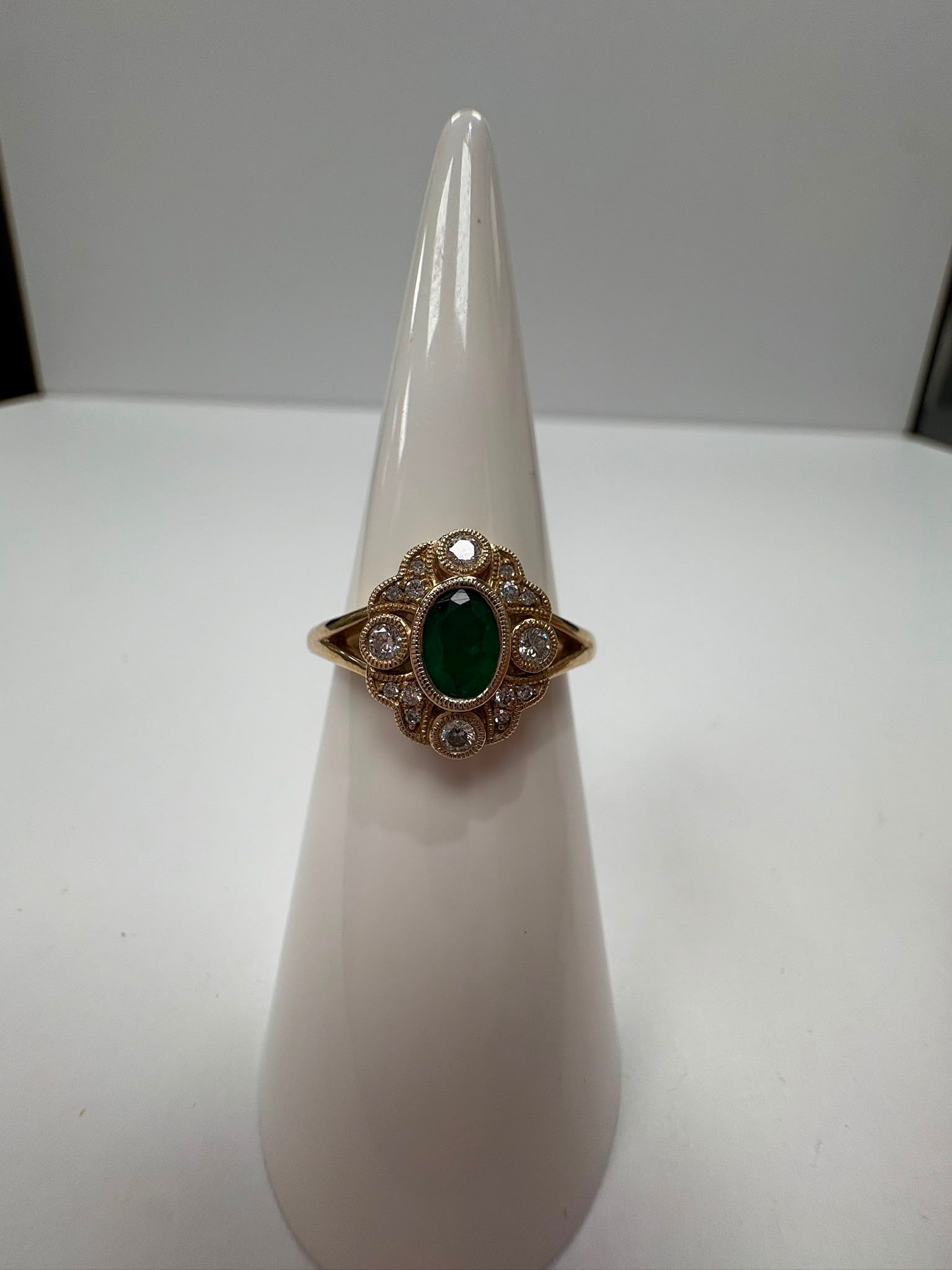 Vintage-style emerald and diamond milgrain cluster ring, 9ct gold, size N. Pre-loved, authenticated. Shop coloured gemstone jewellery in Harrogate.