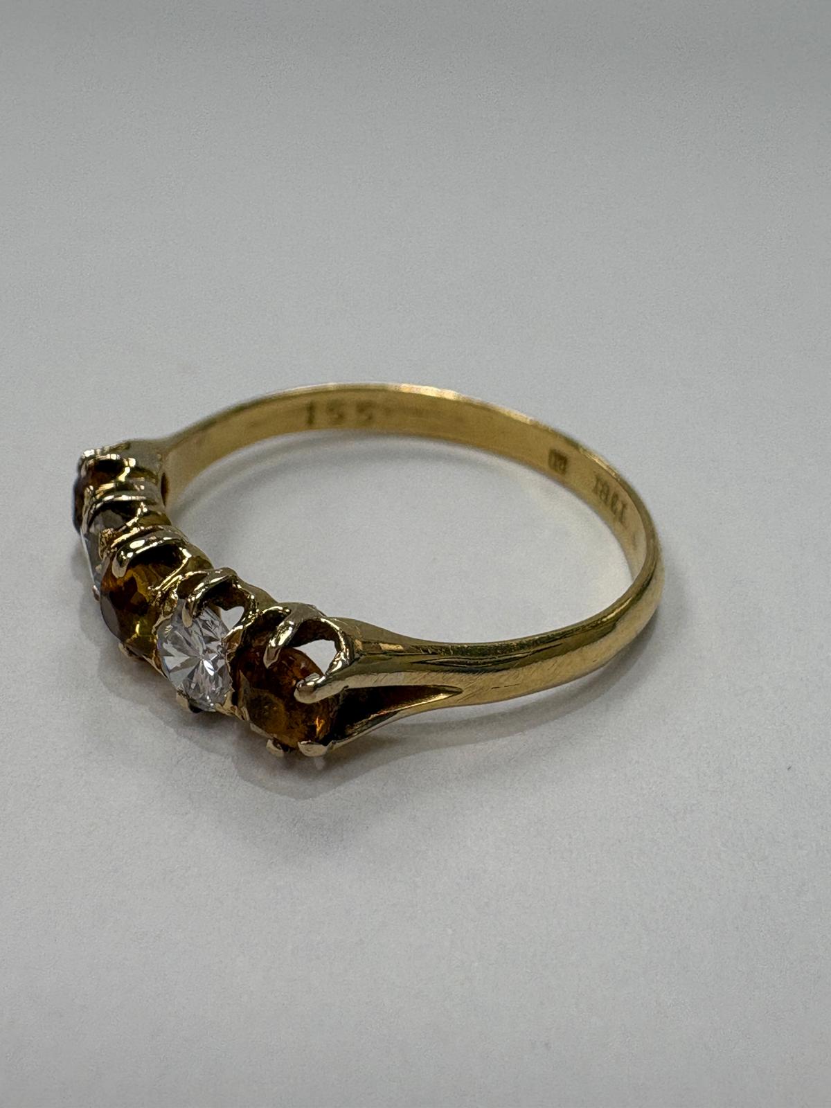 Vintage 18ct yellow gold citrine and white stone five stone graduating ring size S½ with three amber citrines alternating with two white stones in claw setting, shown on white background and worn on finger, available at Fogal & Barnes Harrogate