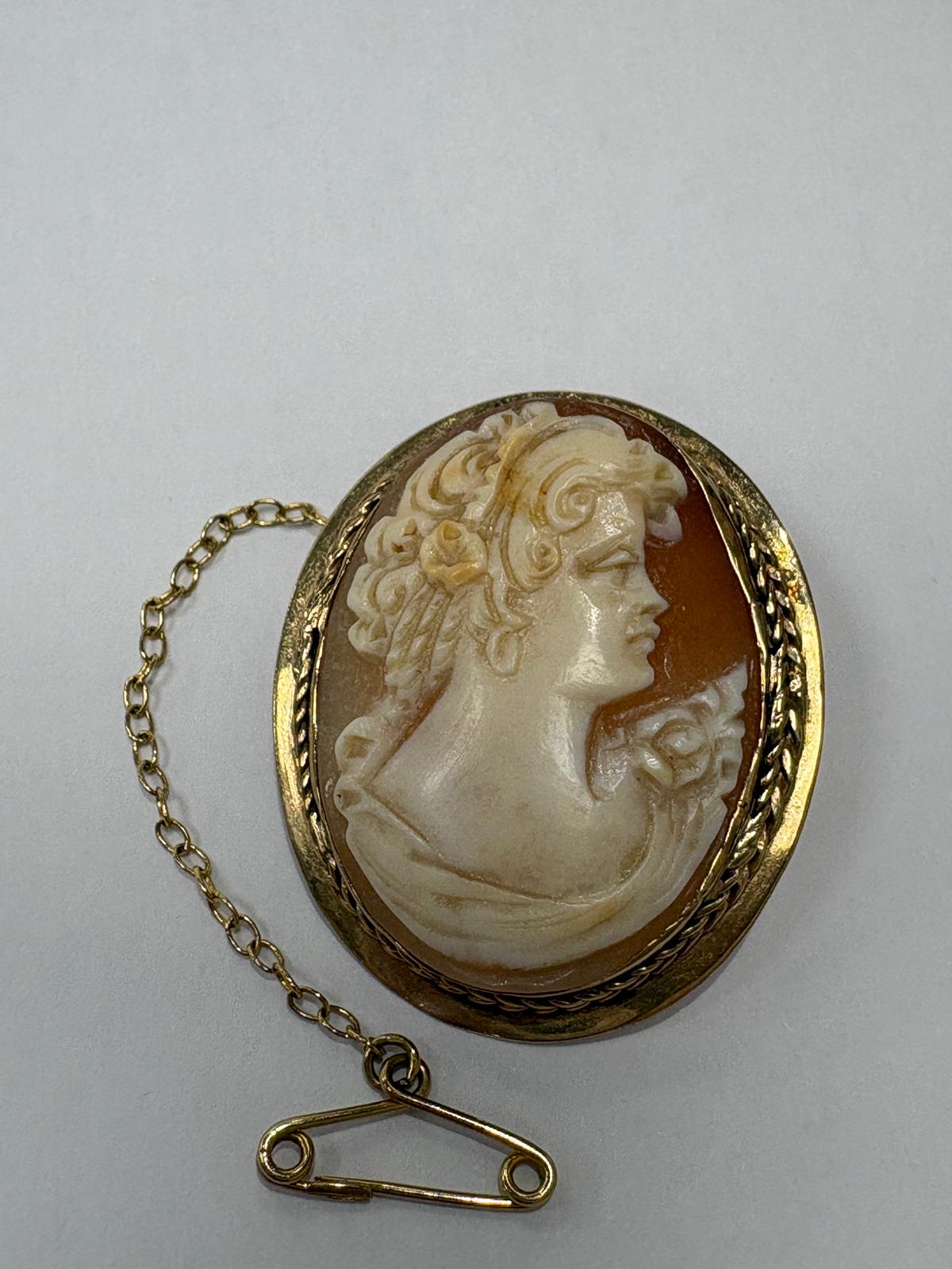 Reverse of Victorian 9ct gold cameo brooch showing original gold pin fitting with safety chain and secondary clasp