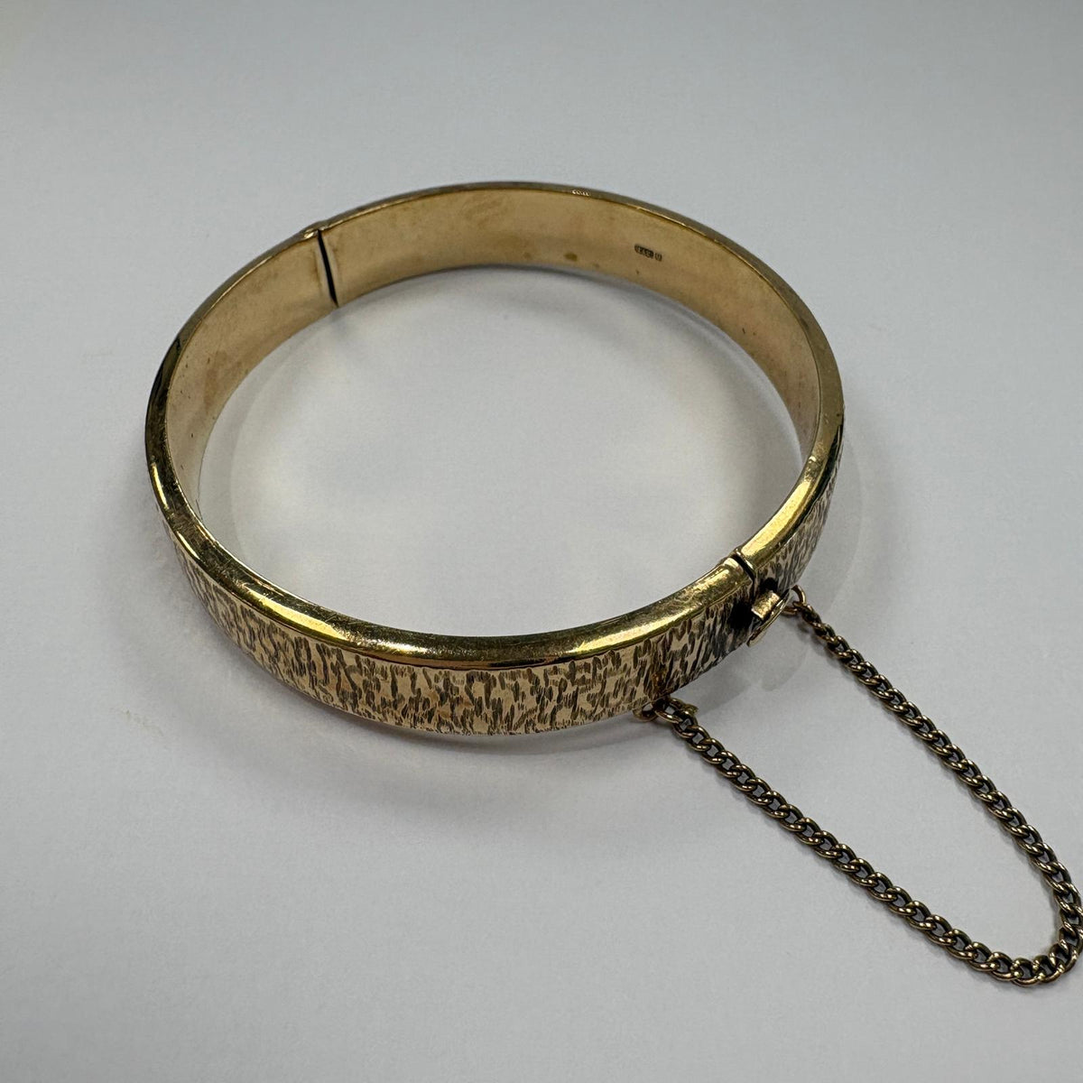vintage gold bangle UK, bark effect bangle, 1970s gold bangle, 9ct gold hinged bangle, 1973 birth year gift, textured gold bangle, vintage 9ct gold bracelet, gold bangle with safety chain