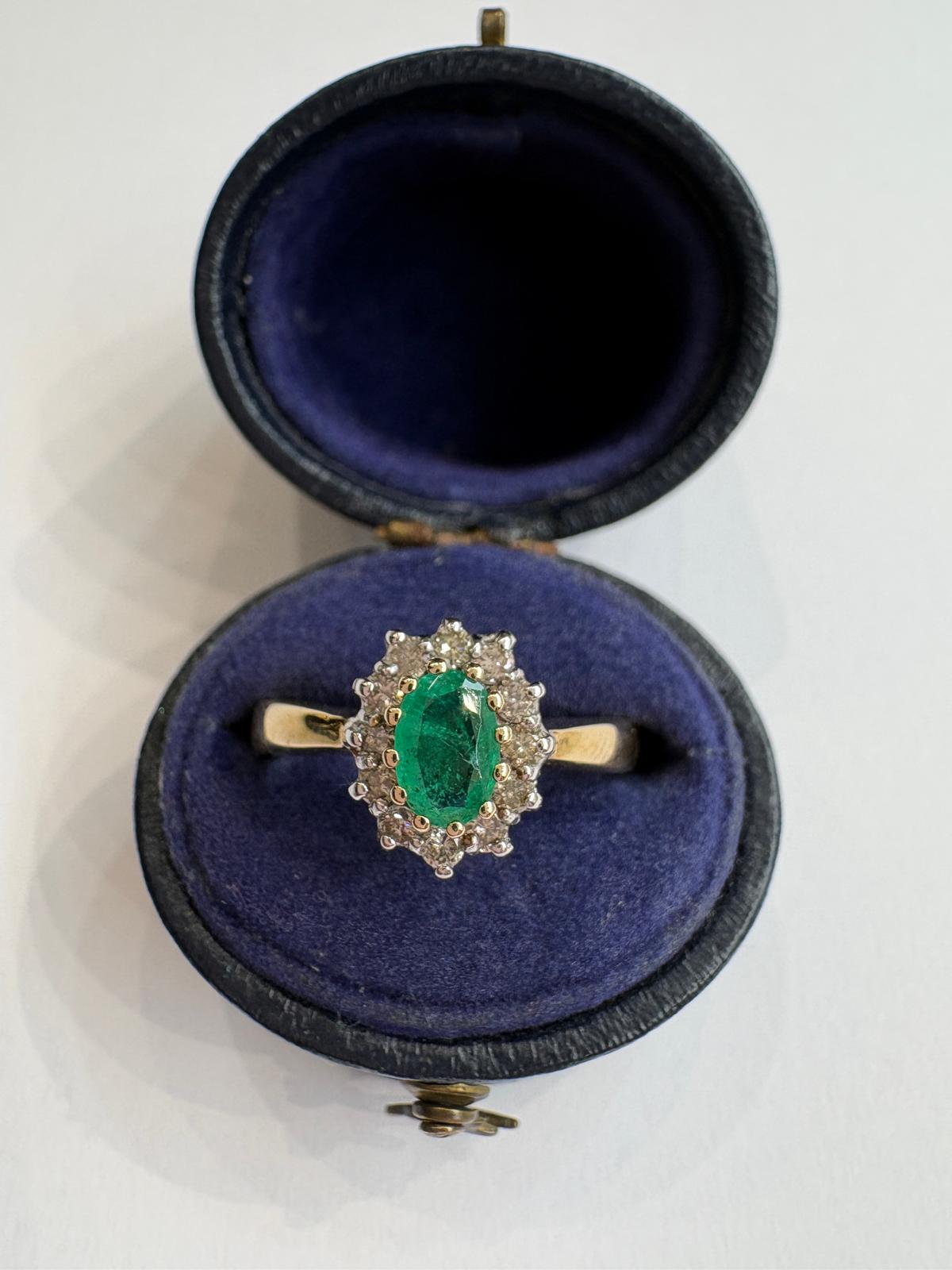 emerald and diamond ring, emerald cluster ring, second hand emerald ring UK, pre-loved emerald ring, vintage emerald ring, 9ct gold emerald ring, oval emerald ring, May birthstone ring, second hand jewellery Harrogate, second hand jewellery Leeds, second hand jewellery York, second hand jewellery Yorkshire, pre-owned emerald ring UK, antique style emerald ring, classic emerald cluster ring, buy second hand emerald ring, emerald ring size N, emerald ring near me, fine jewellery Harrogate, pre-loved jewellery