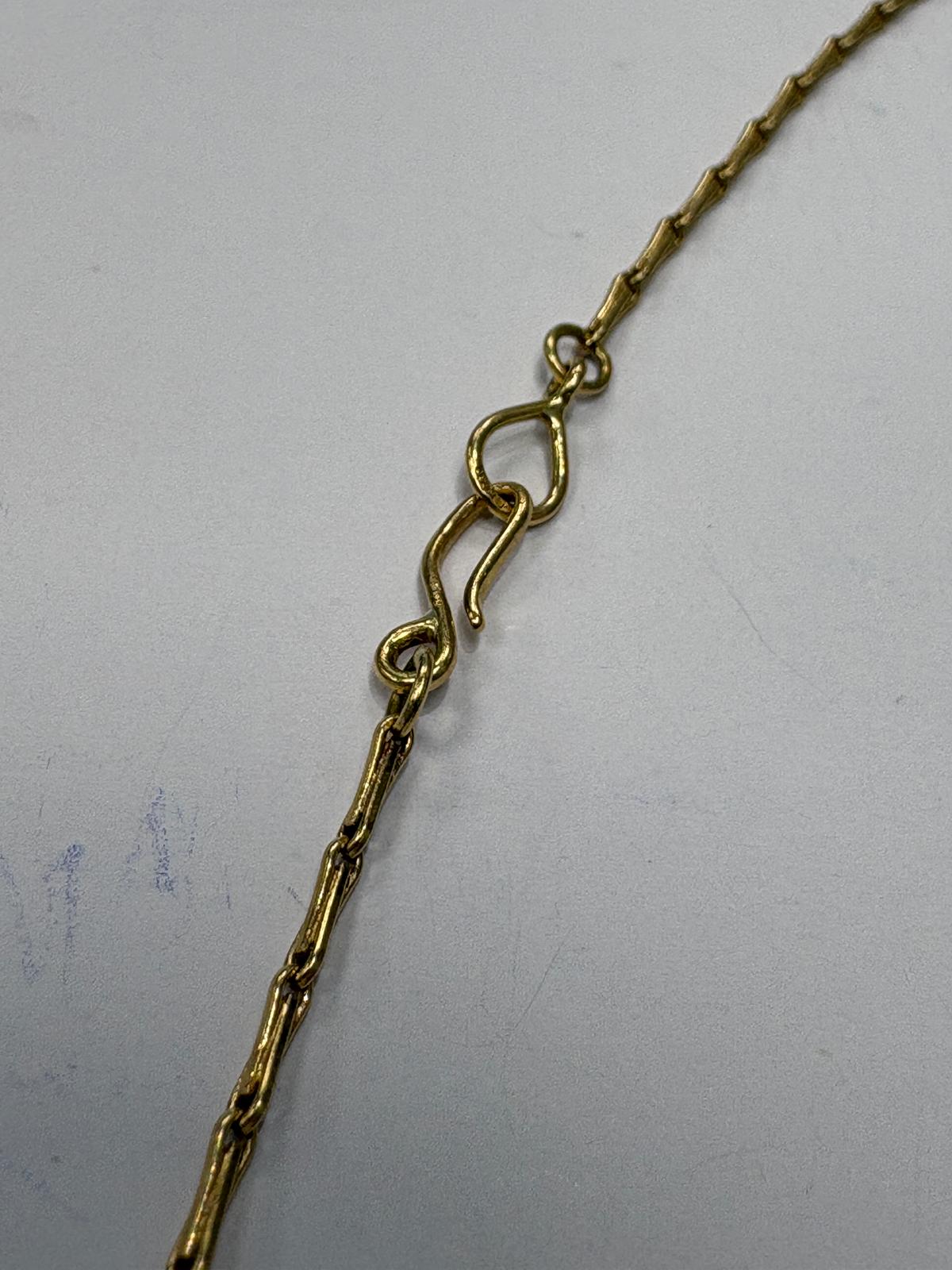 Reverse of 18ct yellow gold Jerusalem Cross pendant showing JERUSALEM inscription and 18K stamp