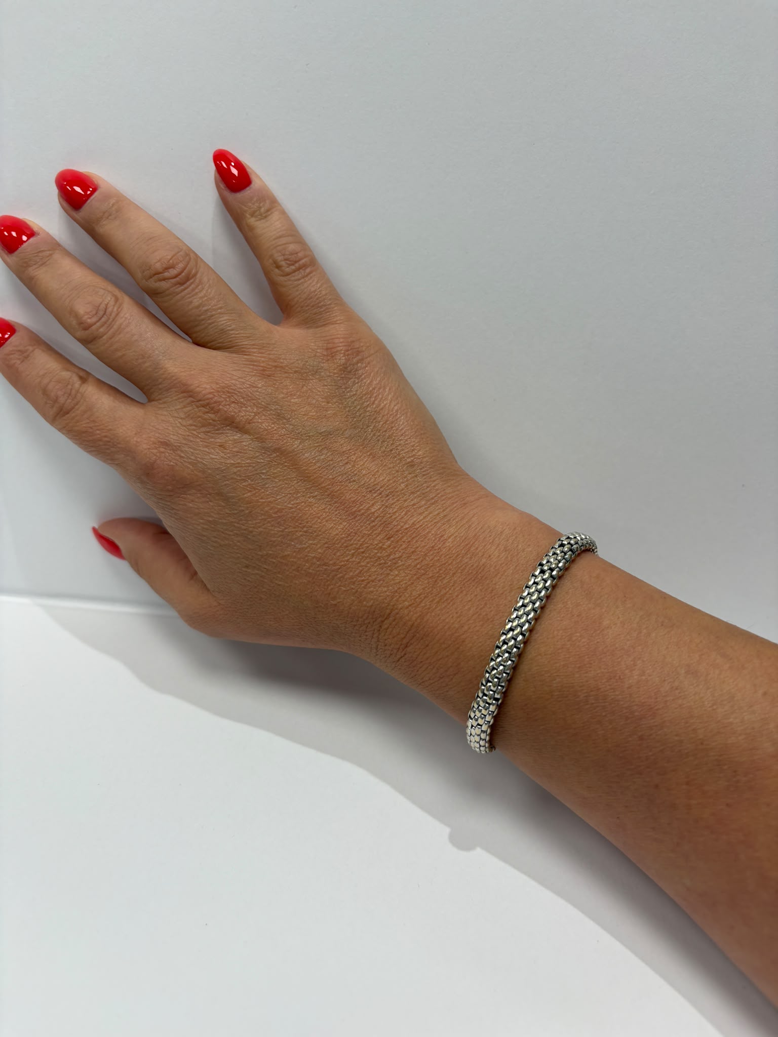 18ct white gold FOPE Flex'it mesh bracelet showing logo tag, pre-loved jewellery Harrogate