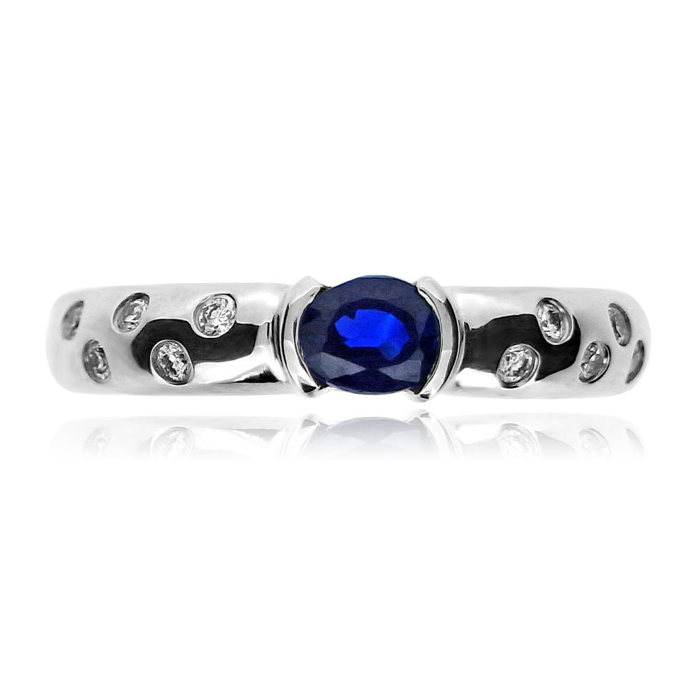 HORIZONTAL OVAL CUT SAPPHIRE AND DIAMOND RING