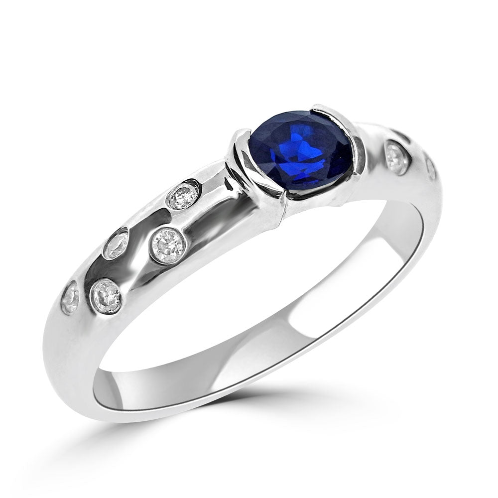 HORIZONTAL OVAL CUT SAPPHIRE AND DIAMOND RING