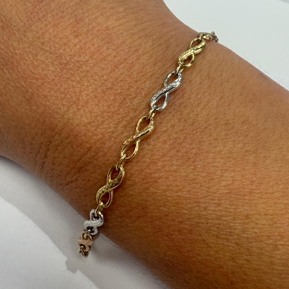 infinity bracelet gold, 9ct gold infinity bracelet, tri-colour gold bracelet, three tone gold bracelet UK, pre-loved gold bracelet, anniversary gift bracelet, rose gold infinity bracelet, second hand gold bracelet