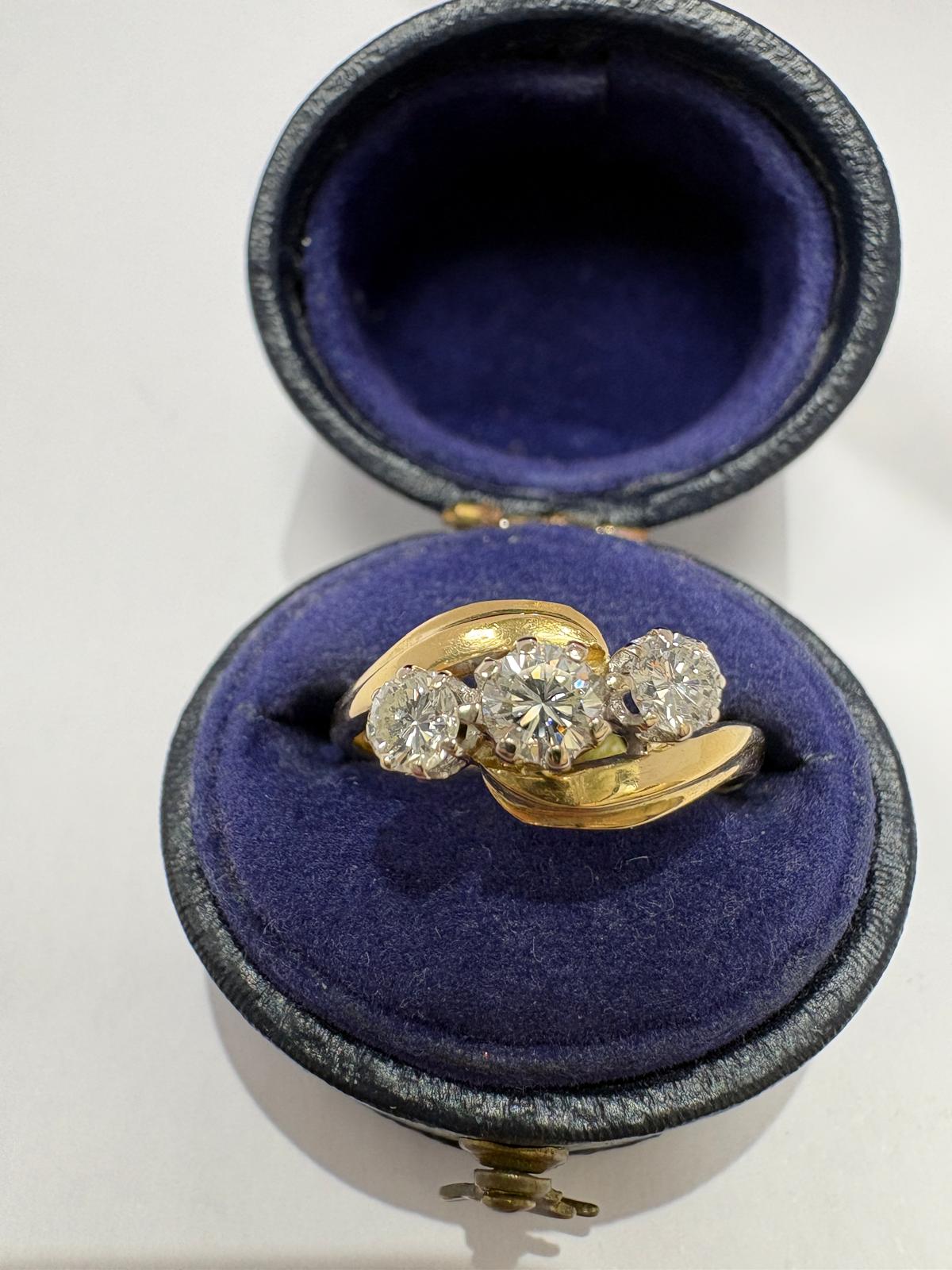 Profile view of antique Victorian 18ct gold diamond bypass ring showing sweeping bypass shank, size K