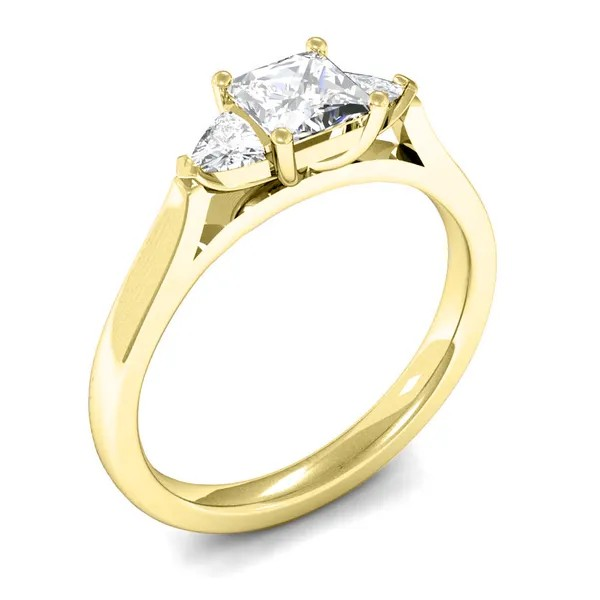 Princess cut diamond Trilogy engagement ring with 2 pear cut diamonds Set on 18k yellow gold fogal and barnes fine jewellers of harrogate independent jewellers.
