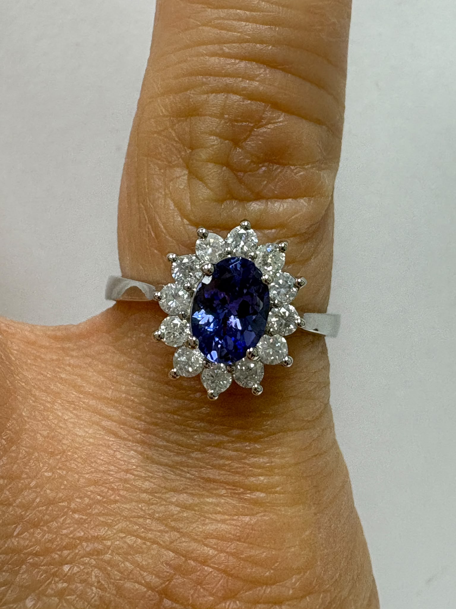 Tanzanite ring diamond halo detail in natural light
