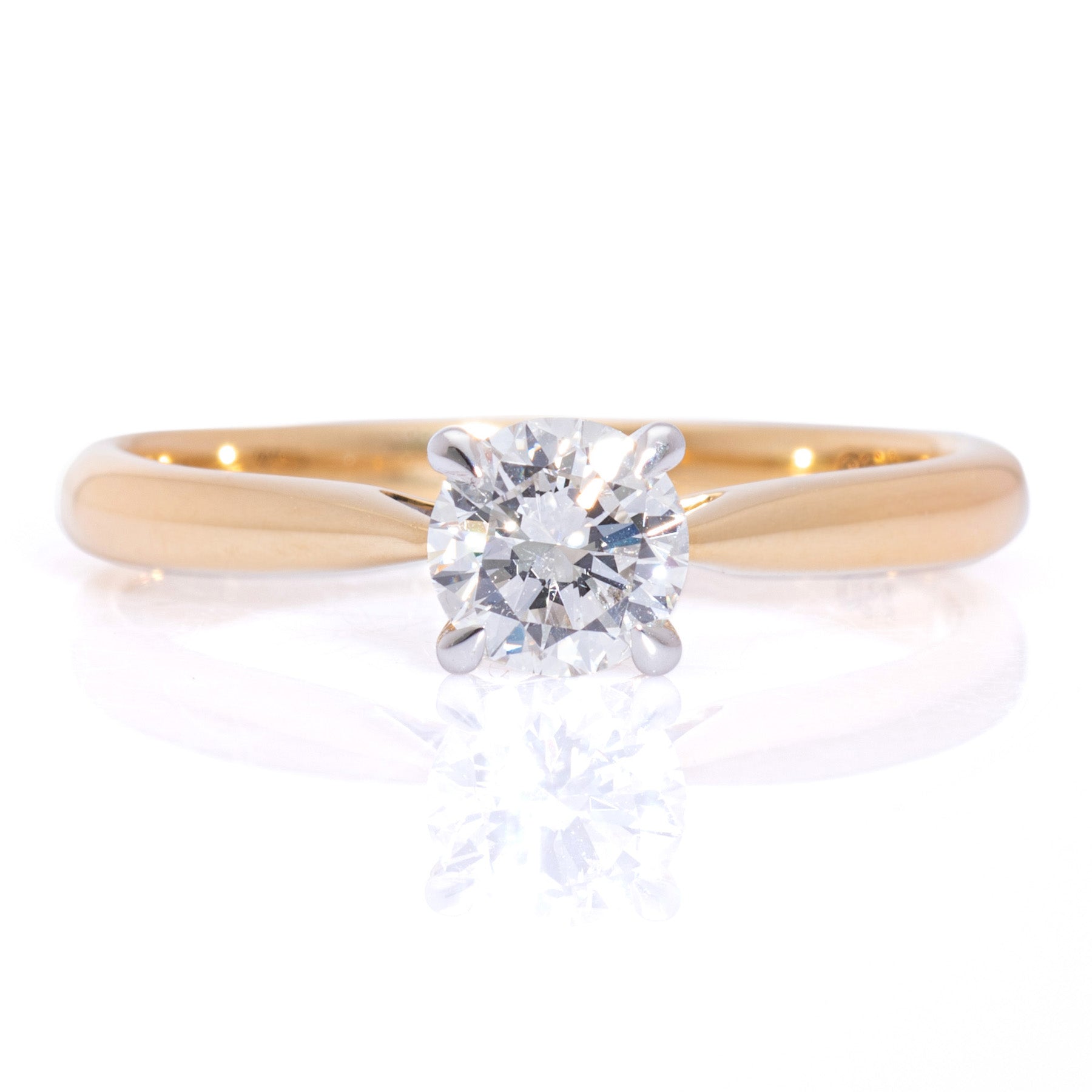 Classic round brilliant diamond solitaire ring claw setting yellow gold band harrogate jewellers fogal and barnes
