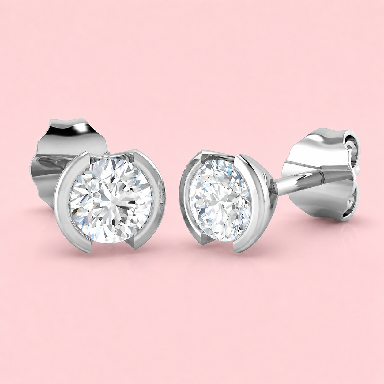 Lab-grown diamond half-bezel stud earrings in 18ct white gold, round brilliant F VS, made to order at Fogal & Barnes Harrogate