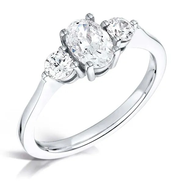 Oval cut diamond and round three stone set on 18k white gold from fogal and barnes harrogate