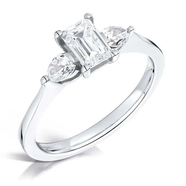 Emerald cut diamond center with 2 diamond pears on the sides set on platinum from fogal and barnes fine jewellers of harrogate