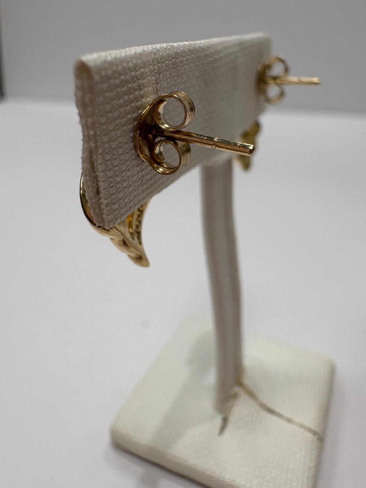 pre-loved diamond earrings, second hand 9ct gold earrings, diamond wave earrings, pre-owned gold earrings UK, channel set diamond studs