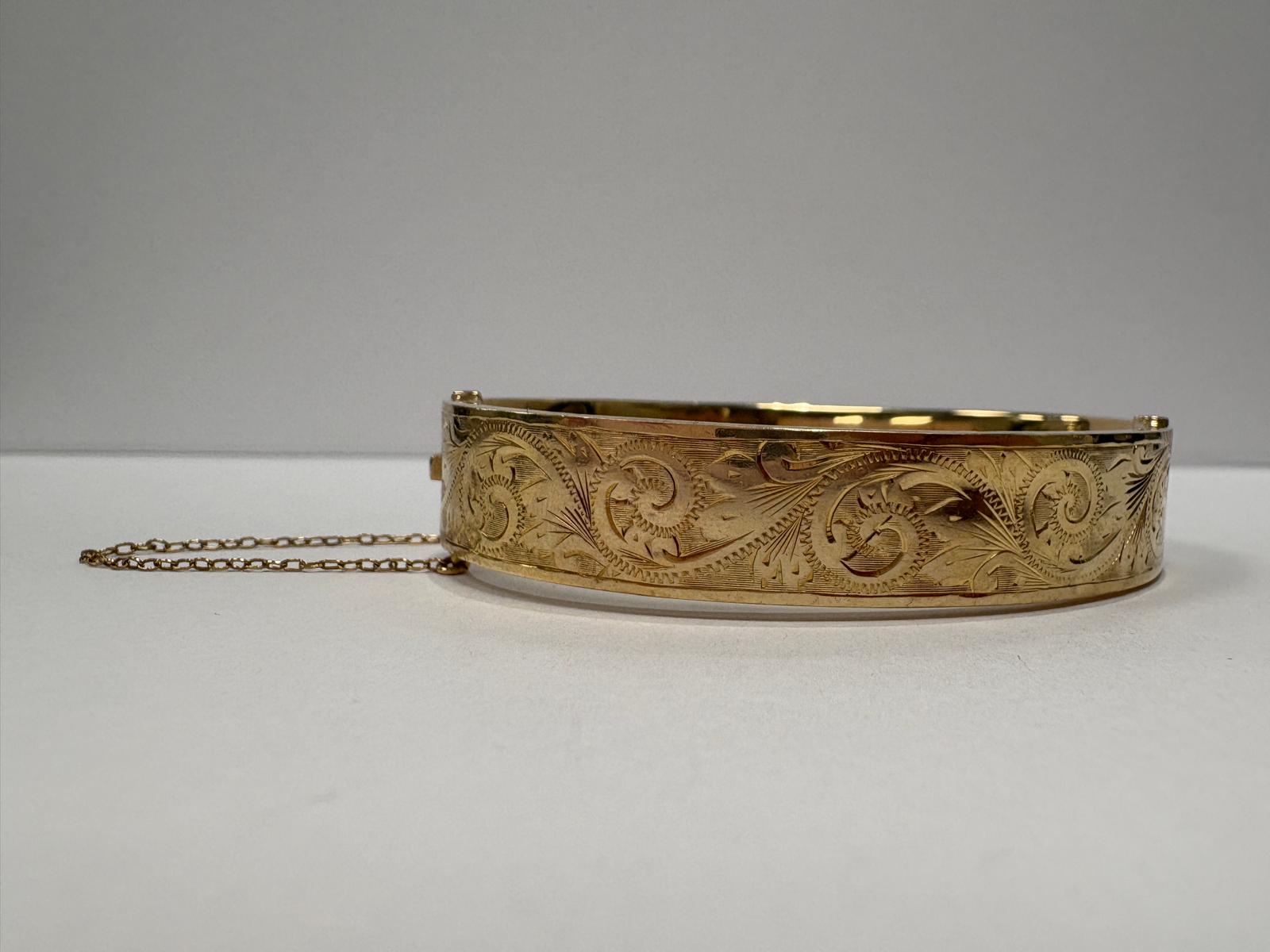 pre-loved gold bangle, vintage engraved bangle, second hand 9ct gold bangle UK, antique style hinged bangle, pre-owned gold jewellery, Victorian style bangle, vintage bangle for sale UK, second hand fine jewellery UK, hand engraved gold bangle
