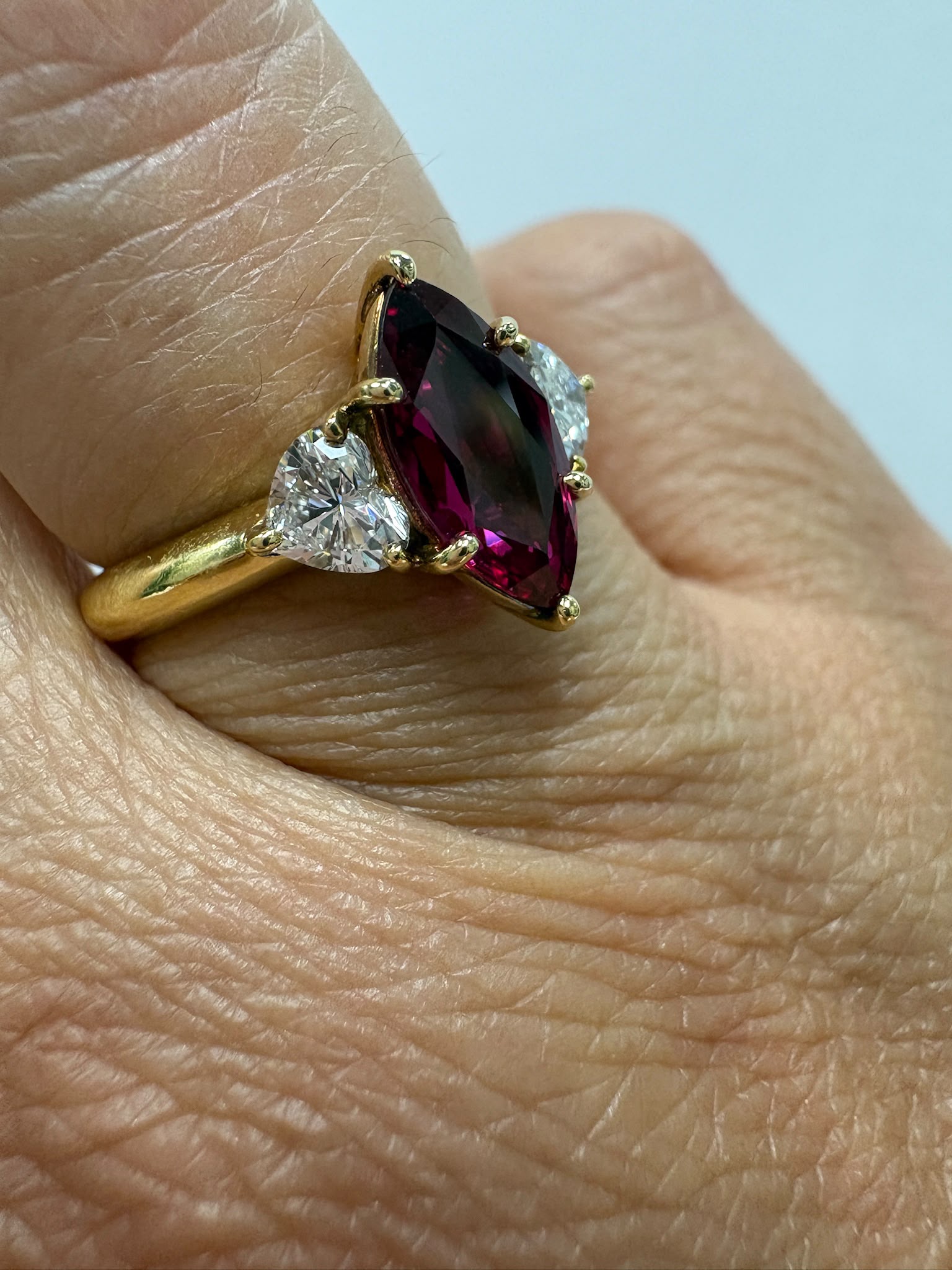 pre-loved ruby ring, second hand 18ct gold ring UK, GIA certified ruby ring, three stone ruby diamond ring, marquise ruby ring, pre-owned fine jewellery UK, heart diamond ring, second hand fine jewellery UK, certified ruby engagement ring