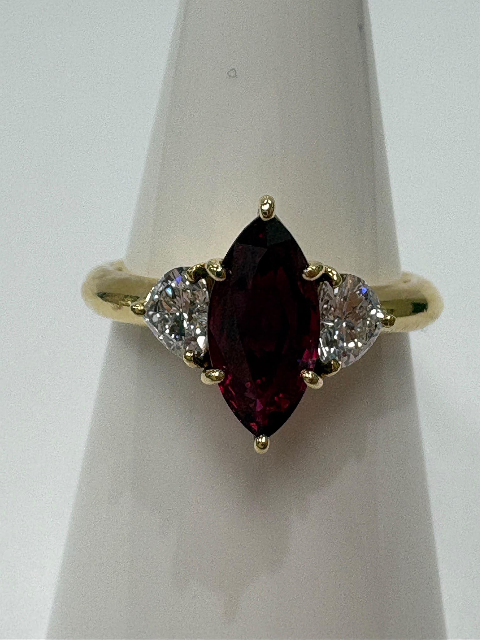 pre-loved ruby ring, second hand 18ct gold ring UK, GIA certified ruby ring, three stone ruby diamond ring, marquise ruby ring, pre-owned fine jewellery UK, heart diamond ring, second hand fine jewellery UK, certified ruby engagement ring