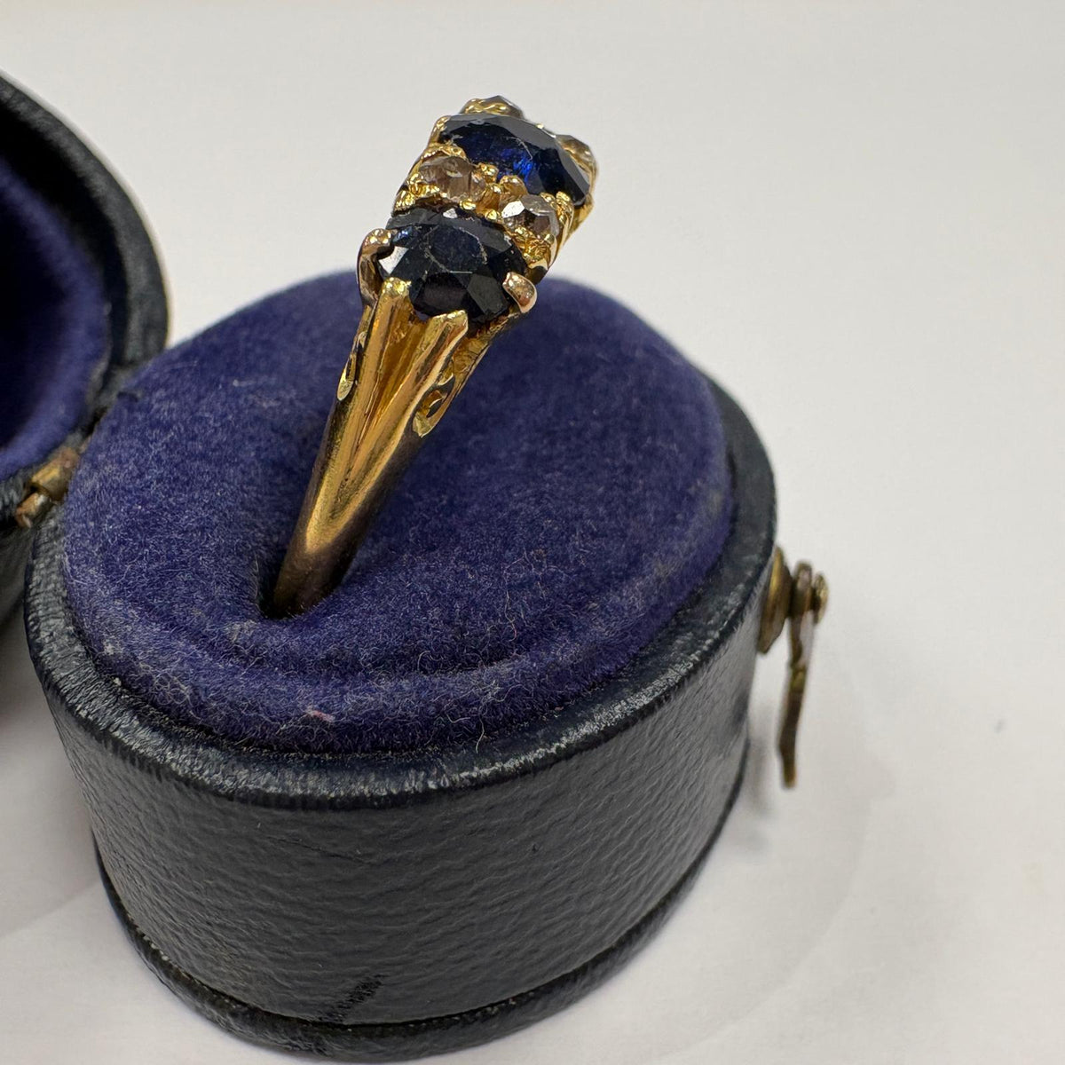 sapphire half hoop ring, carved half hoop ring, antique sapphire ring UK, sapphire and diamond ring, Edwardian sapphire ring, 18ct gold sapphire ring, alternative engagement ring, three stone sapphire ring