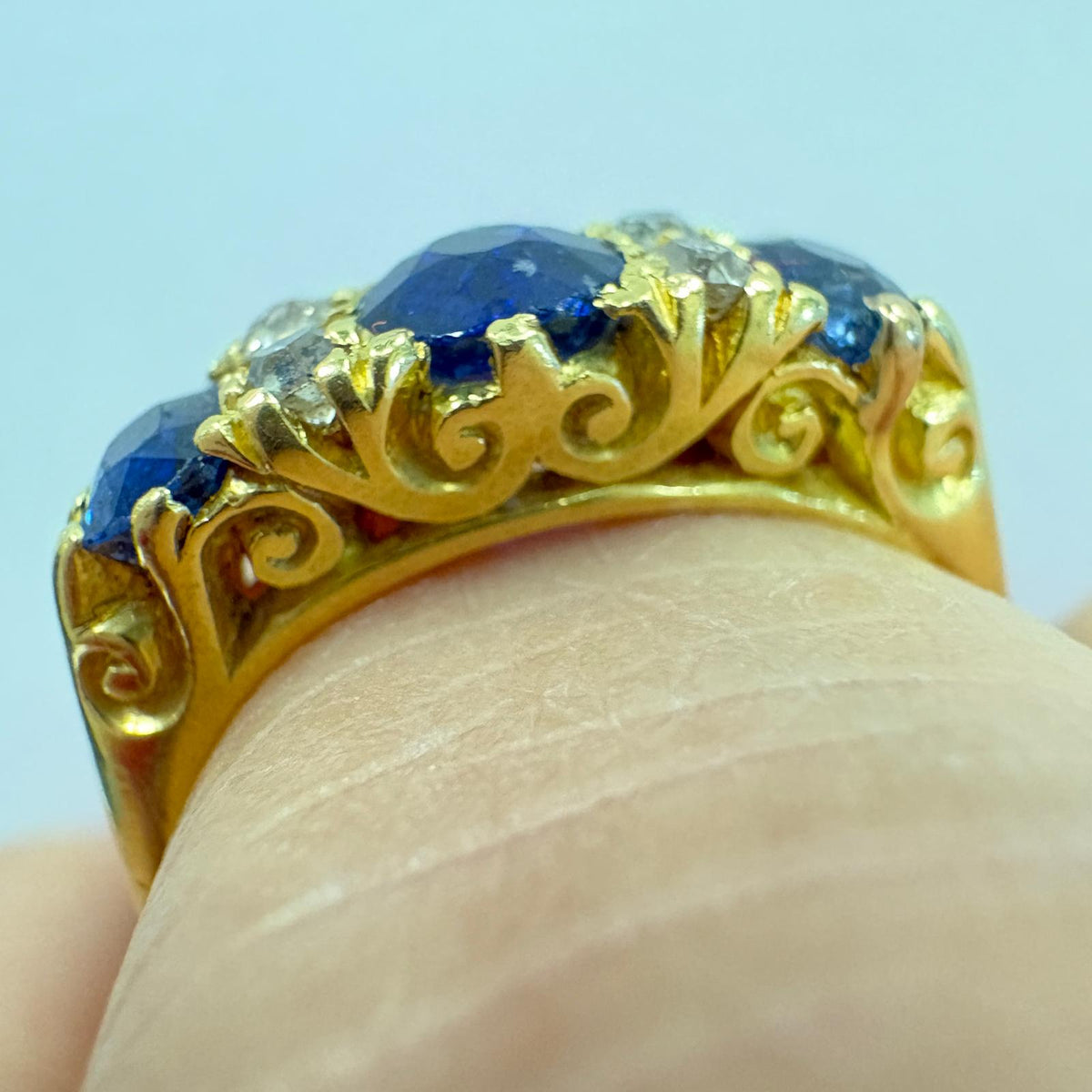sapphire half hoop ring, carved half hoop ring, antique sapphire ring UK, sapphire and diamond ring, Edwardian sapphire ring, 18ct gold sapphire ring, alternative engagement ring, three stone sapphire ring