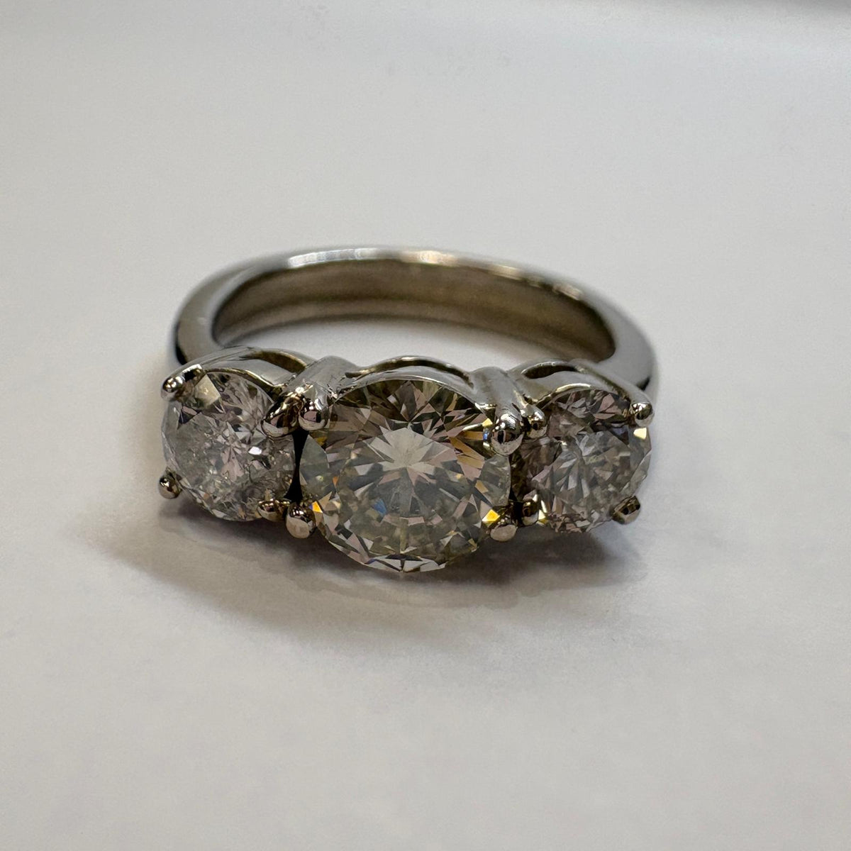 three stone diamond ring, trilogy diamond ring UK, platinum diamond ring, pre-loved engagement ring, second hand diamond ring, 1.5 carat diamond ring, anniversary diamond ring, pre-owned trilogy ring
