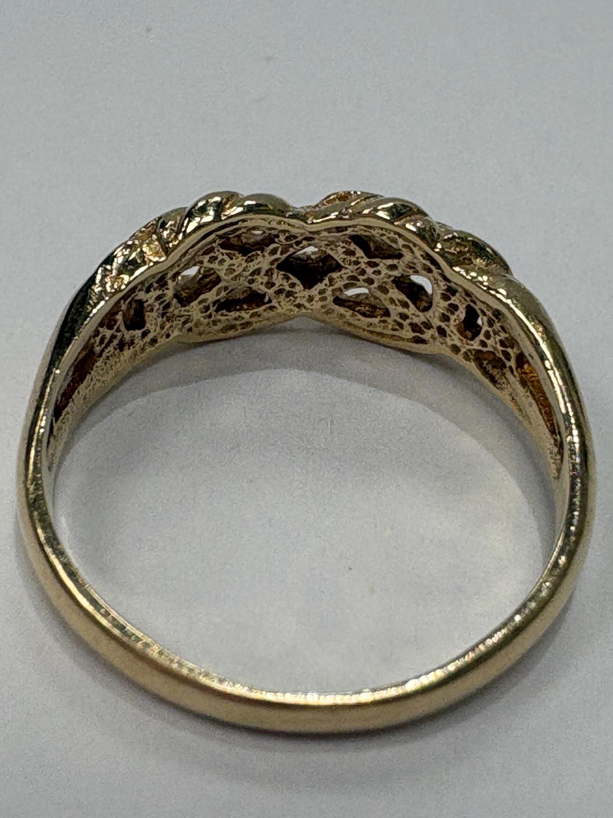 Preloved 9ct yellow gold keeper knot ring size N 2.50g with open lattice and filigree underside shown on ring cone and close up on white background, available at Fogal & Barnes Harrogate