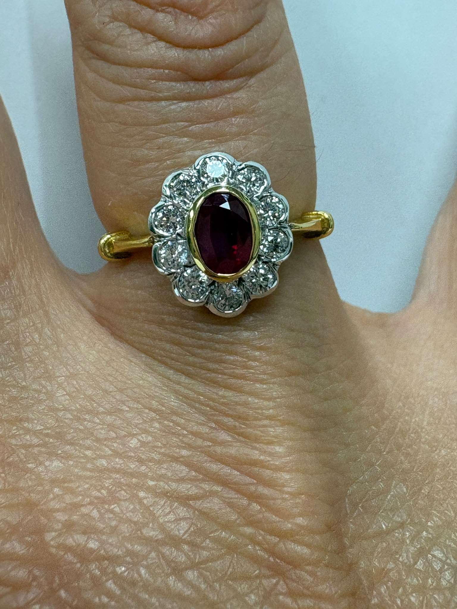 vintage ruby diamond ring, 18ct gold ruby cluster ring, oval ruby ring, ruby engagement ring alternative, pre-loved ruby ring UK, vintage cluster ring Harrogate, diamond halo ruby ring, second hand ruby ring size N