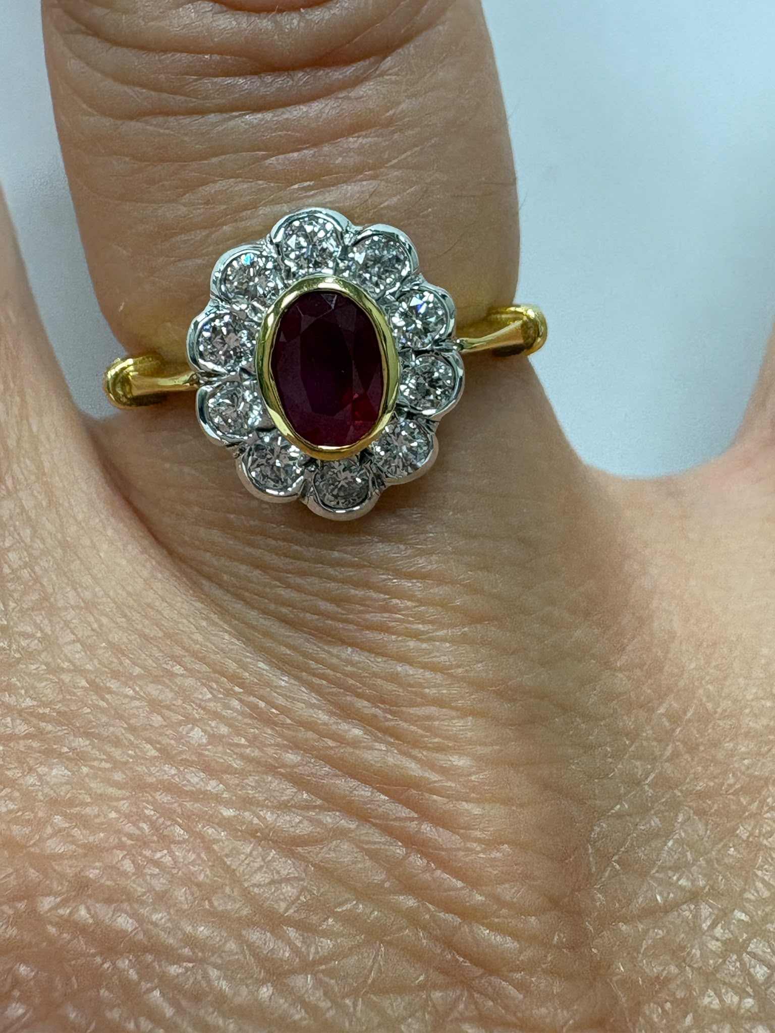 vintage ruby diamond ring, 18ct gold ruby cluster ring, oval ruby ring, ruby engagement ring alternative, pre-loved ruby ring UK, vintage cluster ring Harrogate, diamond halo ruby ring, second hand ruby ring size N