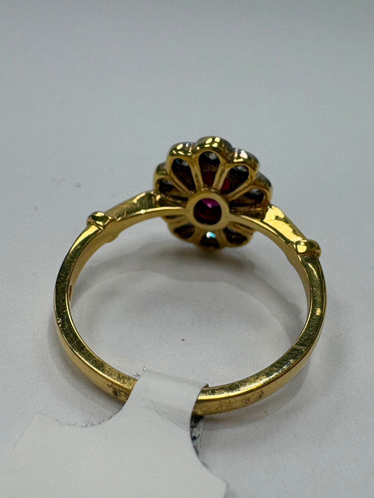 vintage ruby diamond ring, 18ct gold ruby cluster ring, oval ruby ring, ruby engagement ring alternative, pre-loved ruby ring UK, vintage cluster ring Harrogate, diamond halo ruby ring, second hand ruby ring size N