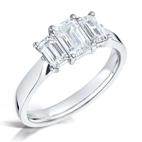 Emerald cut diamond center with 2 diamond emeralds on the sides set on platinum from fogal and barnes fine jewellers of harrogate