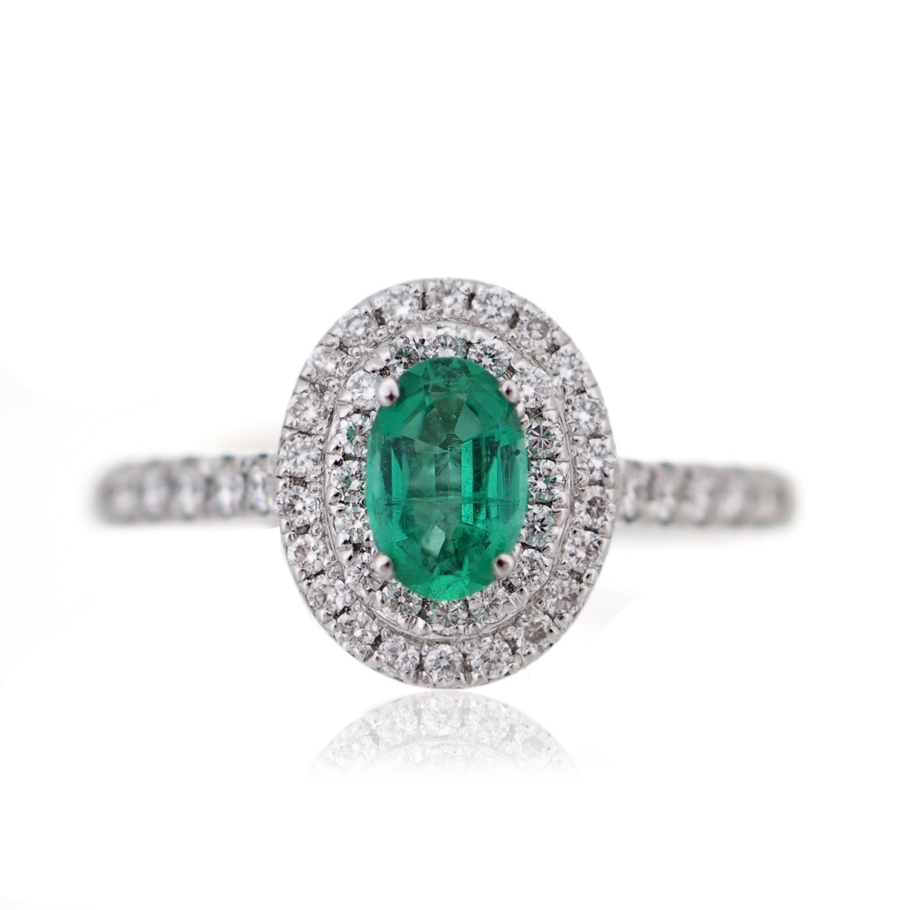 Oval cut Emerald and Diamond double Halo engagement ring white gold Harrogate Jewellers Fogal and Barnes