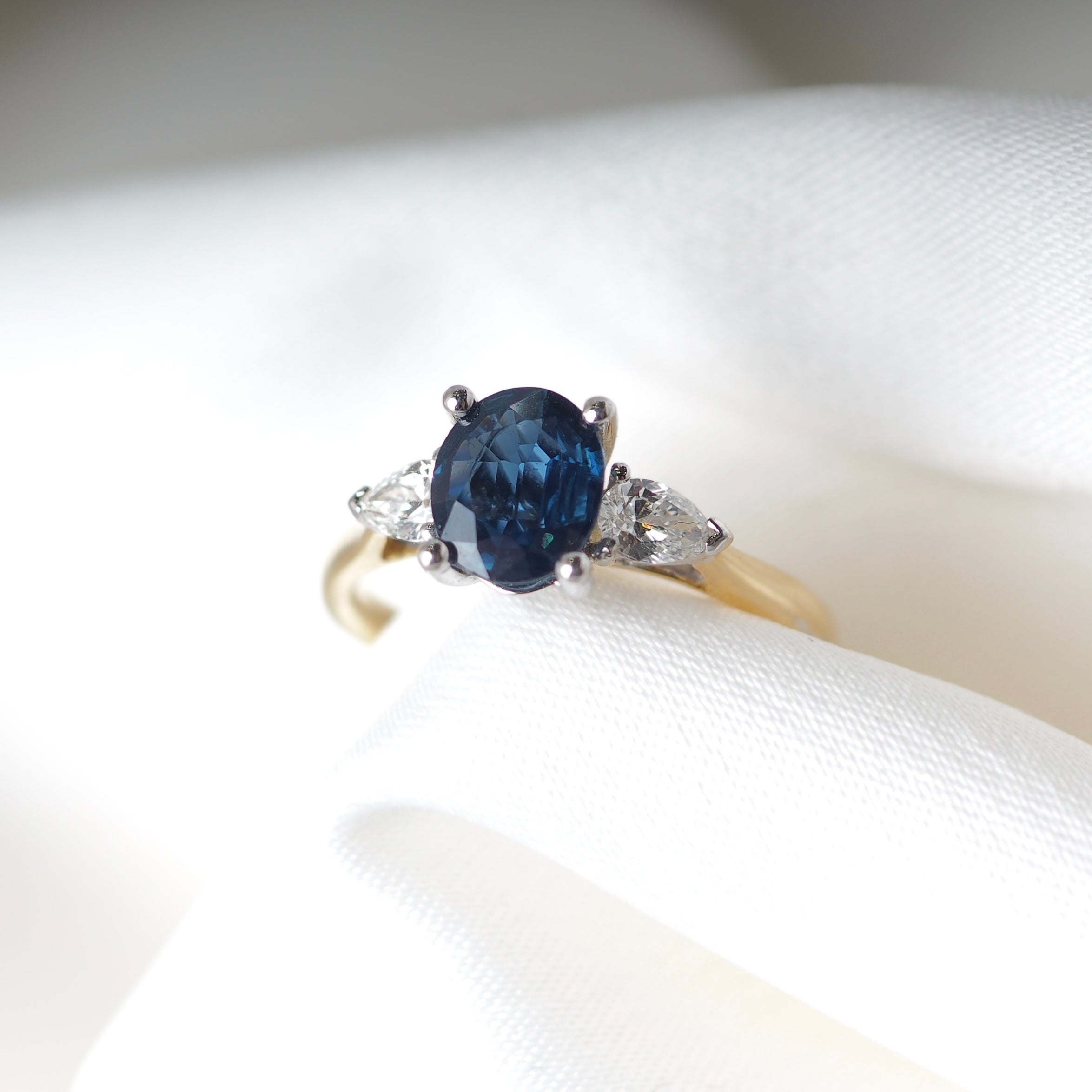 OVAL CUT SAPPHIRE AND DIAMOND TRILOGY ENGAGEMENT RING