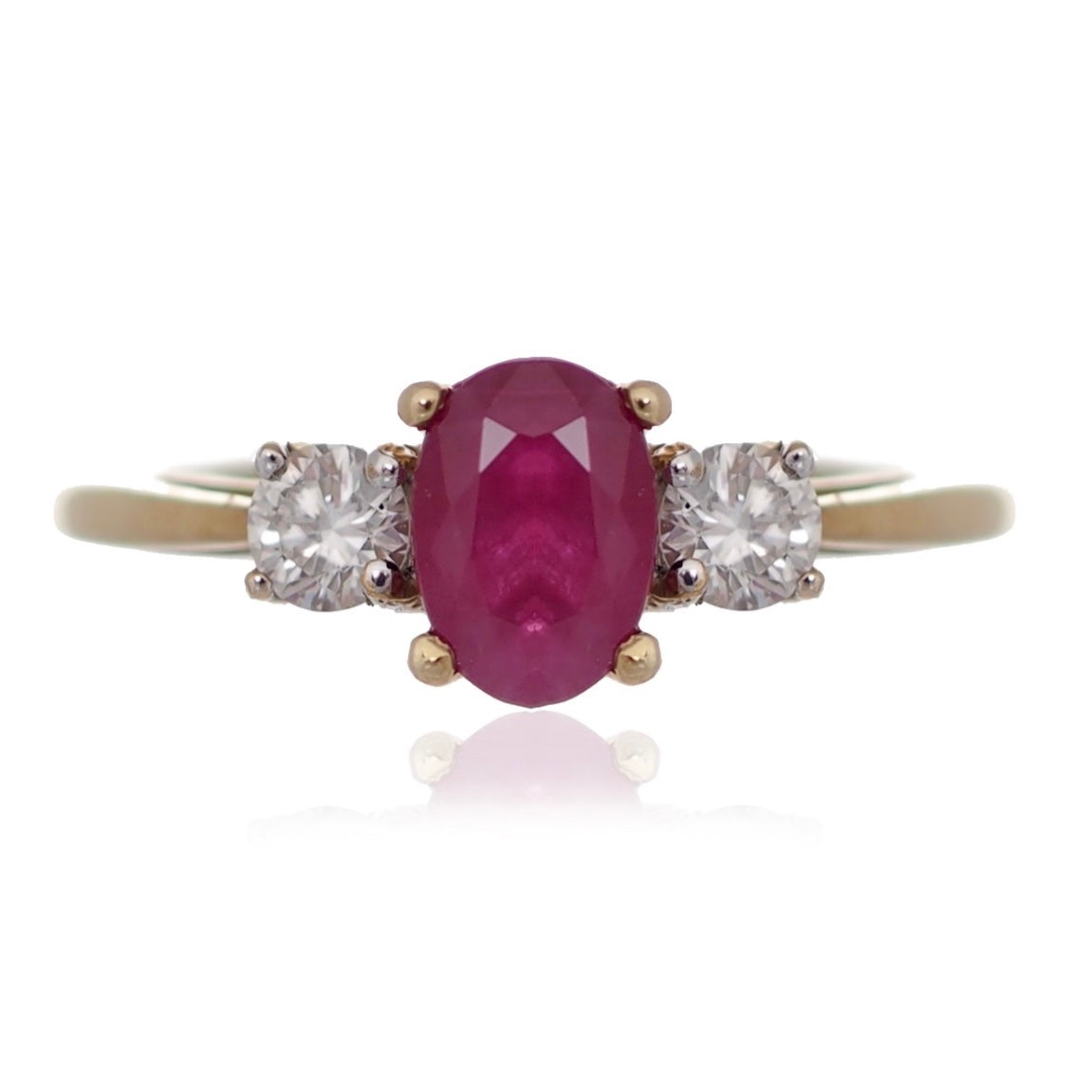 Oval Ruby and diamond trilogy engagement ring yellow gold Harrogate jewellers Fogal and barnes