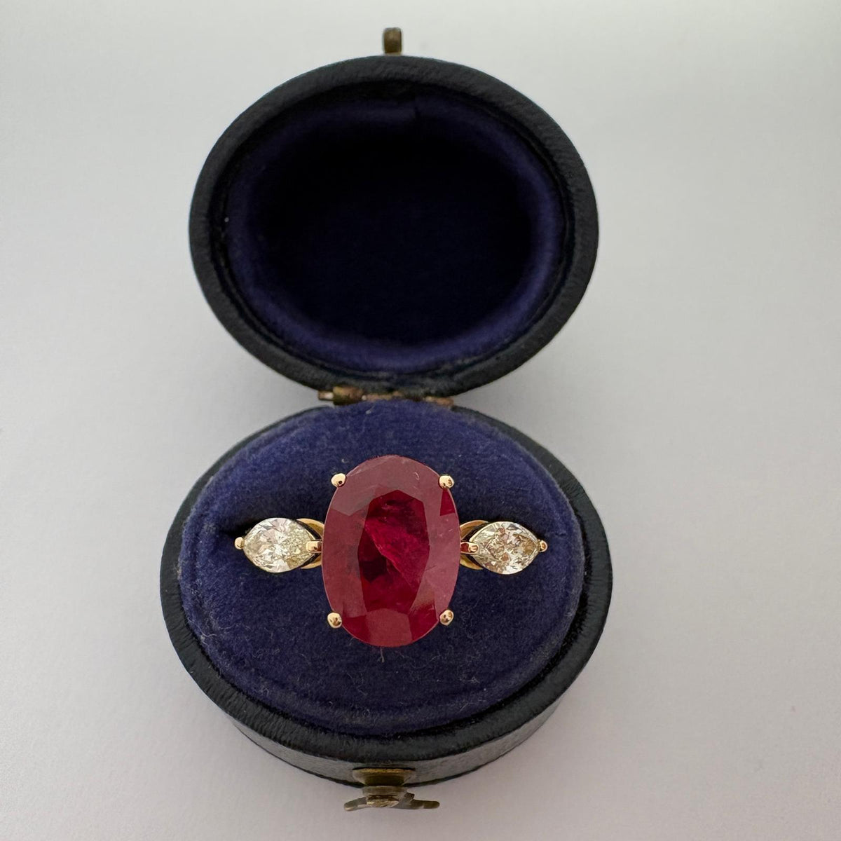 ruby and diamond ring, 3 carat ruby ring, oval ruby ring UK, marquise diamond ring, east west marquise ring, ruby engagement ring, ruby anniversary ring, 18ct gold ruby ring