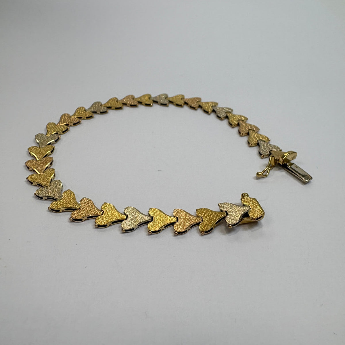 18ct gold heart bracelet, tri-colour gold bracelet, heart link bracelet UK, pre-loved 18ct gold bracelet, anniversary bracelet gold, rose gold heart bracelet, three colour gold bracelet, second hand gold bracelet