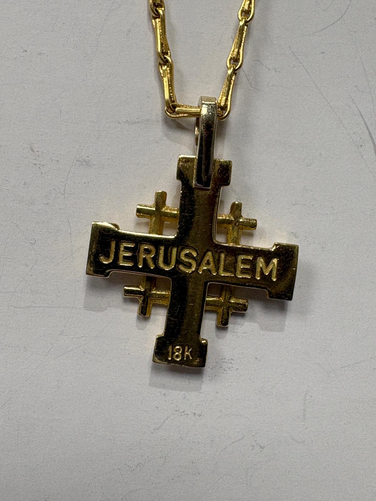 Close-up detail of pre-loved 18ct yellow gold Jerusalem Cross pendant face with white stone centre