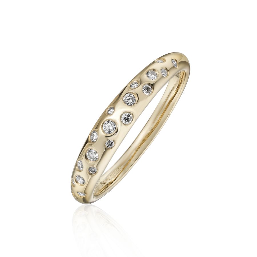 Gold ring with embedded diamonds on a white background
