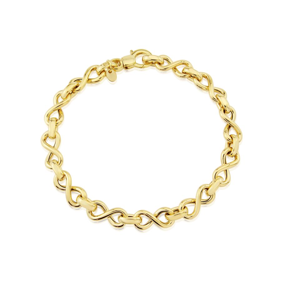 9ct yellow gold infinity bracelet worn on wrist, highlighting its minimalist style and timeless elegance. Designed for everyday wear by Fogal and Barnes, Harrogate.