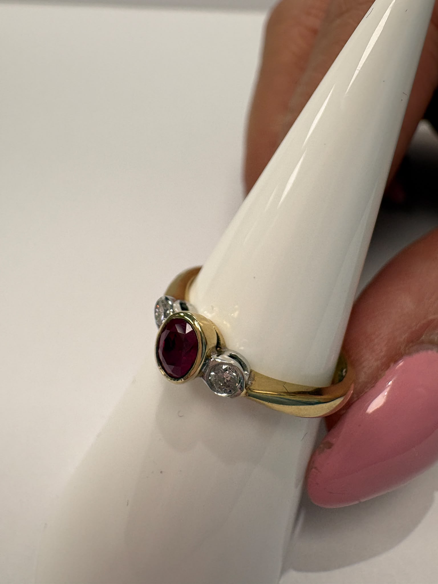 ruby and diamond ring, bezel set ruby ring, two tone gold ruby ring, second hand ruby ring UK, pre-loved three stone ring, vintage ruby diamond ring, 9ct gold ruby ring, ruby diamond trilogy ring, second hand jewellery Harrogate, second hand jewellery Leeds, second hand jewellery York, second hand jewellery Yorkshire, pre-owned ruby ring UK, bezel set gemstone ring, buy second hand ruby ring, ruby ring size N, ruby ring near me, fine jewellery Harrogate, pre-loved jewellery Yorkshire
