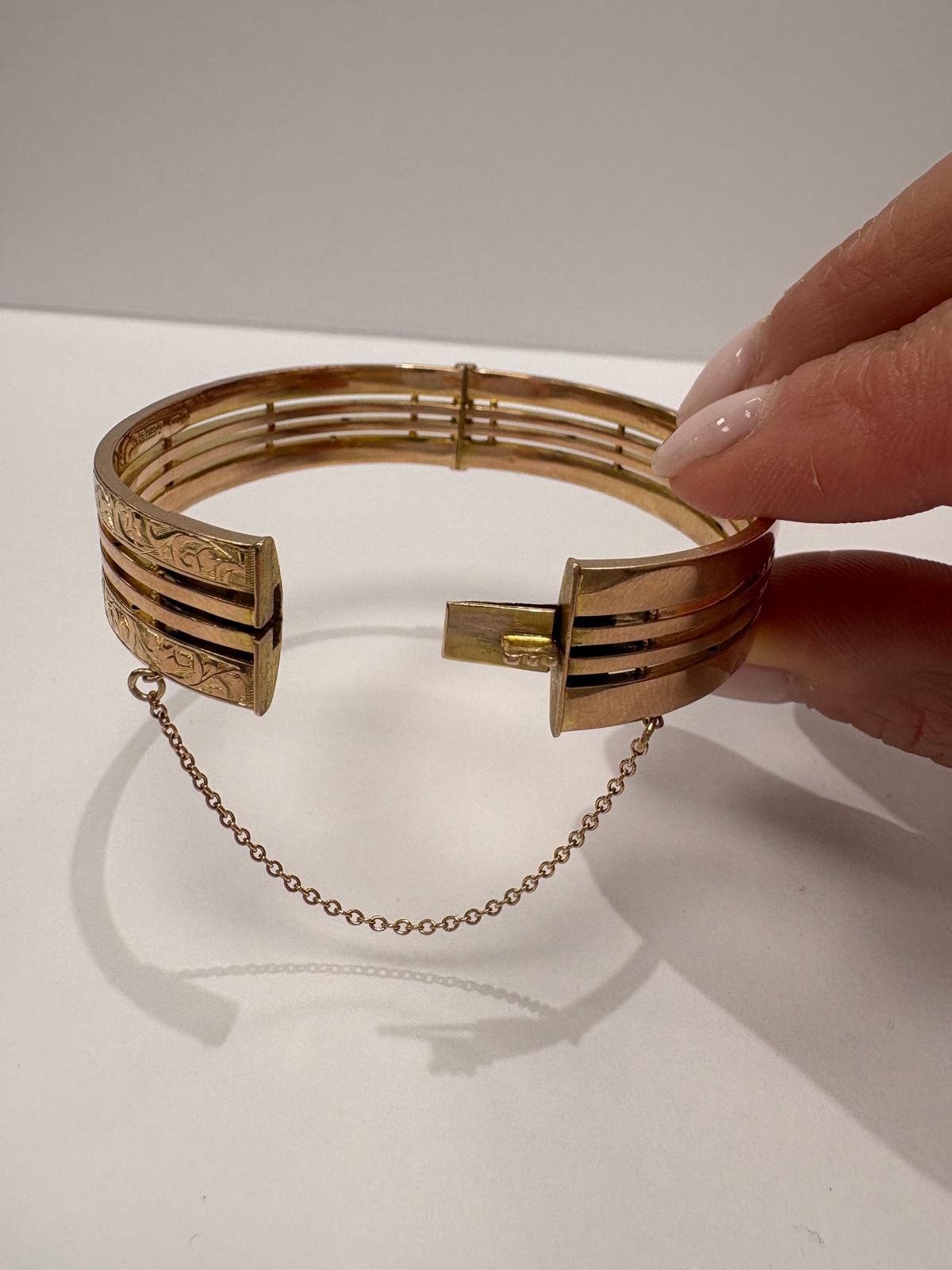 9ct gold gate bangle open showing hinged box clasp and safety chain