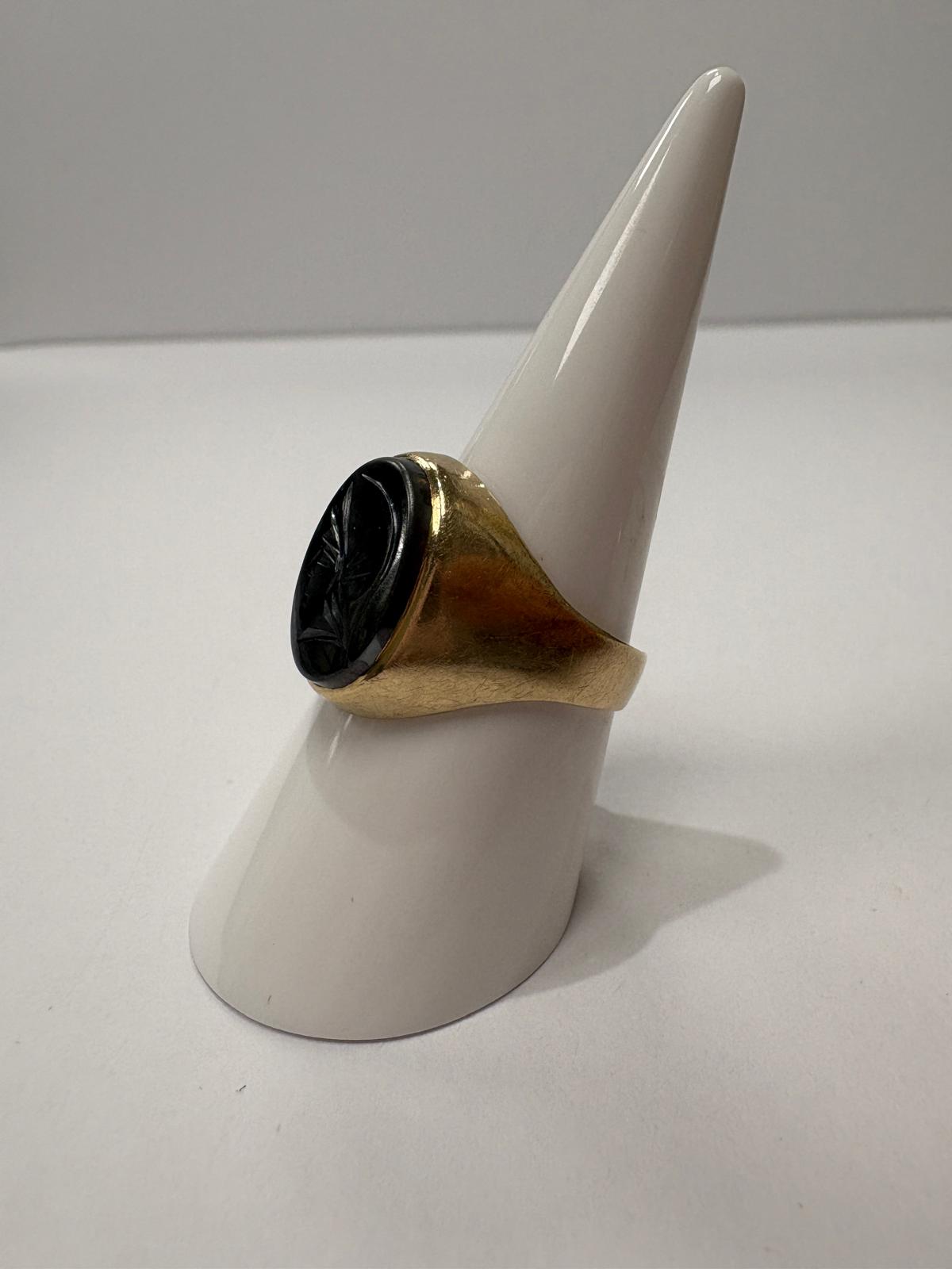 9ct gold signet ring on display stand, front facing, intaglio detail