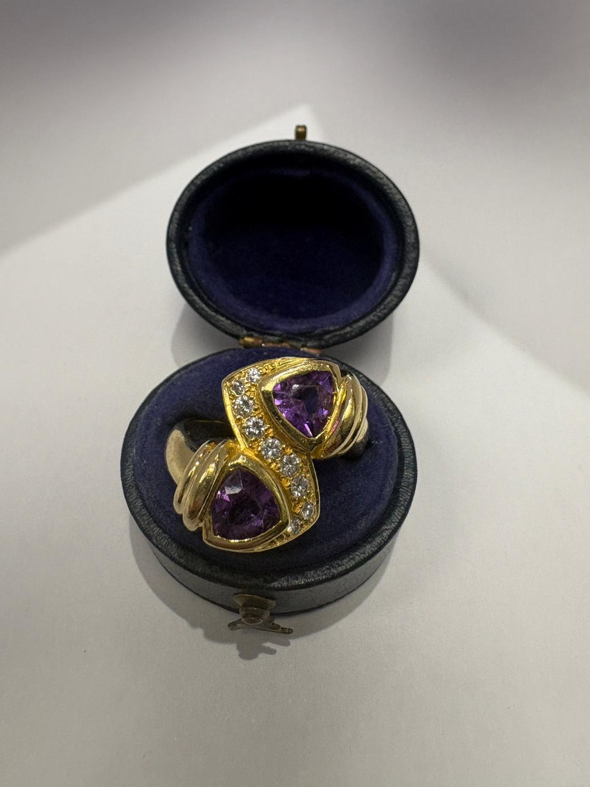 Pre-loved 18ct yellow gold natural amethyst and diamond toi et moi ring shown on hand, size N
